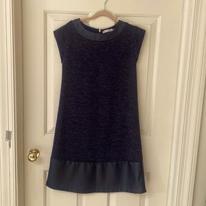 Wool short sleeve dress with leather bottom and collar trim.